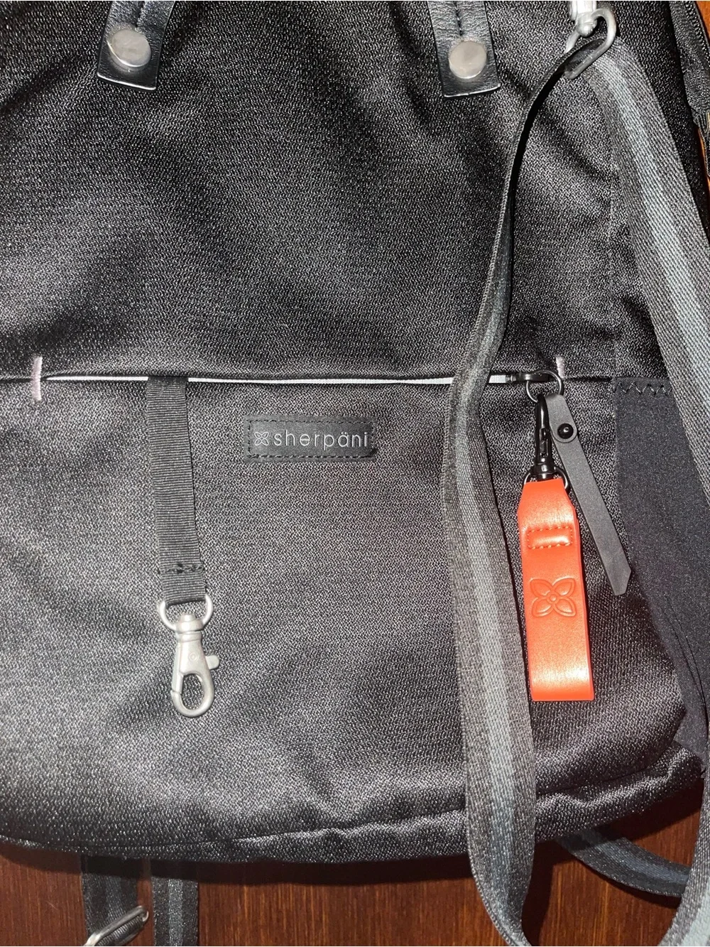 Sherpani Black Backpack with Orange Accent